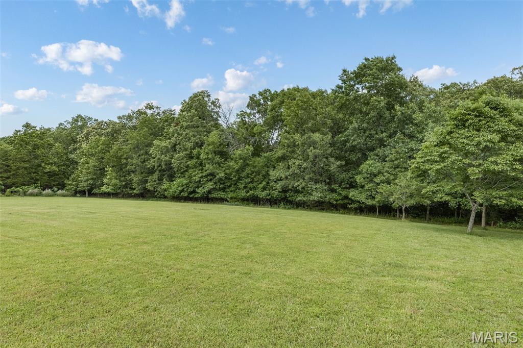 Have you been dreaming about acreage? A place where you can build the home you've always wanted, enjoy a little breathing room, and wake up to the sounds of nature instead of the hustle?
This beautiful 5-acre homesite is tucked into one of the area's most scenic rolling countryside communities. Driving through the subdivision, you will hear the wildlife and see be welcomed by mature trees, and established  roads and homes that blend perfectly into the natural surroundings.
The current owner originally planned to build here, but life had other plans—creating an opportunity for someone new to bring their vision to life. Whether you're imagining a private retreat, a forever home, or simply more space to enjoy the outdoors, this property offers the perfect setting. Lots like this rarely become available in established communities. Take a drive, walk the property, and see for yourself why this could be the place where your next chapter begins. Space to breathe, room to grow, and the opportunity to build exactly what you've been dreaming of.
