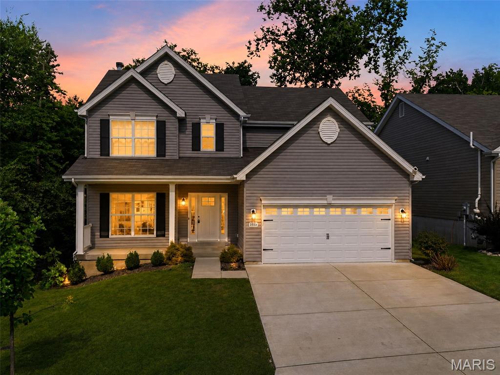 STUNNING TWO-STORY SINGLE-FAMILY HOME WITH PRIVATE BACKYARD OASIS.  Welcome to this move-in ready home situated on a cul-de-sac. Combining modern design, functional spaces, and outdoor entertaining options, this home offers comfort and convenience inside and out.  Inviting Curb Appeal & Main Level Open Living

Step up to a covered front porch framed by landscaping and enter into a bright entryway featuring luxury vinyl plank flooring and dark banister staircases leading to both upper and lower levels.  Spacious Living Room: Expansive living area boasting rich vinyl flooring, a modern ceiling fan, and a wood-burning fireplace framed by a classic white mantel. Large bay windows flood the space with natural light while offering lush greenery views.

Gourmet Kitchen & Dining: Beautifully renovated kitchen equipped with crisp white cabinetry, durable patterned countertops, stainless steel appliances (including microwave, smooth-top range, and dishwasher), double sink, and a center island. The attached dining nook features a traditional chandelier light fixture and direct sliding glass door access to the back deck.

Comfortable Bedrooms & Additional Features

Private Quarters: Generously sized bedrooms featuring fresh neutral wall paint, plush wall-to-wall carpeting, and modern overhead light fixtures/ceiling fans with stylish crystal accents.  All bedrooms have walk in closets!

Spacious Garage: Attached two-car garage offering high ceilings, automatic door opener access, and ample room for vehicular parking and extra storage needs.

Unbeatable Outdoor Living Space

Expansive Deck: Step through the glass slider onto a large composite deck complete with white posts, black metal balusters, and stairs leading down to the lawn—ideal for outdoor dining, grilling, or relaxing.

Fenced Yard & Retaining Wall: Fully fenced, lush green backyard featuring a stone retaining wall planter bed, flanked by mature trees for ultimate privacy and peace of mind.