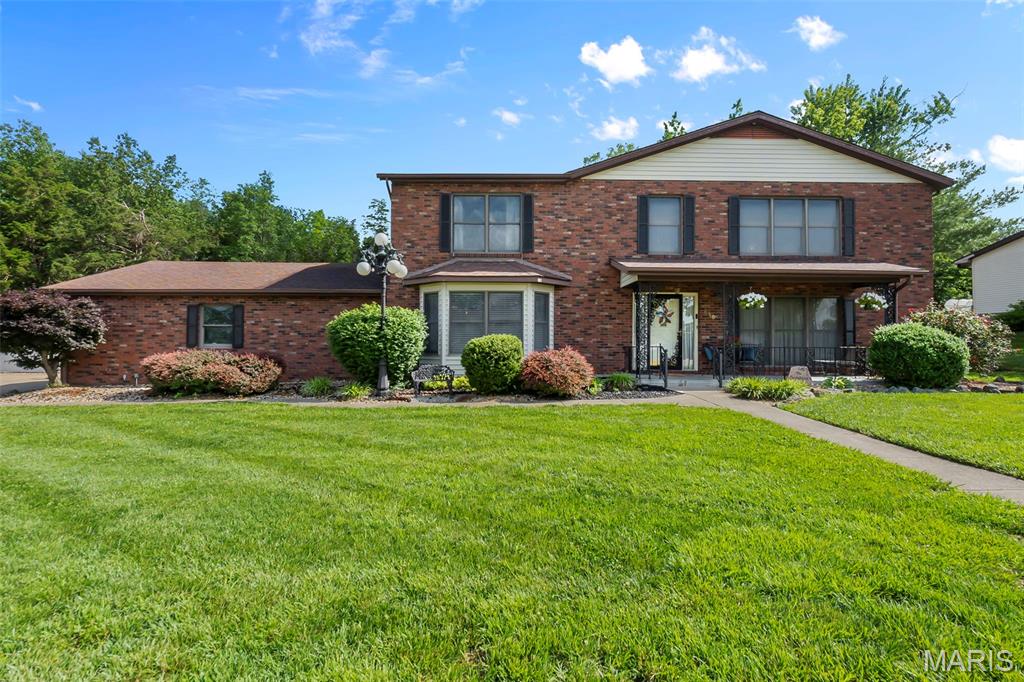 Step into timeless elegance with this stunning 3 bedroom, 2.5 bath all brick home offering character, space, and luxurious 1990s architectural charm beautifully blended with modern updates. A grand foyer with an impressive staircase welcomes you into the home, while an upper-level catwalk overlooks the main living space and leads to spacious bedrooms and baths. The oversized primary suite is a true retreat featuring an expansive layout and walk-in closet. A striking spiral staircase leads down into the kitchen, complete with newer stainless steel appliances and excellent flow into the separate formal dining room, perfect for entertaining. The sunken living room showcases classic sophistication with a beautiful brick wood-burning fireplace, bringing back the era of bold design and elevated luxury. The completely remodeled family room offers the perfect hangout space with a wet bar and direct access to the backyard patio. Additional highlights include a separate laundry room with storage, a beautifully remodeled half bath, and thoughtful updates throughout. Situated on two oversized lots totaling over half an acre, the backyard provides endless possibilities with an above-ground pool and plenty of room to relax, entertain, or play. Conveniently located just minutes from the park center, local parks, and the town square, this exceptional property offers space, style, and location all in one.