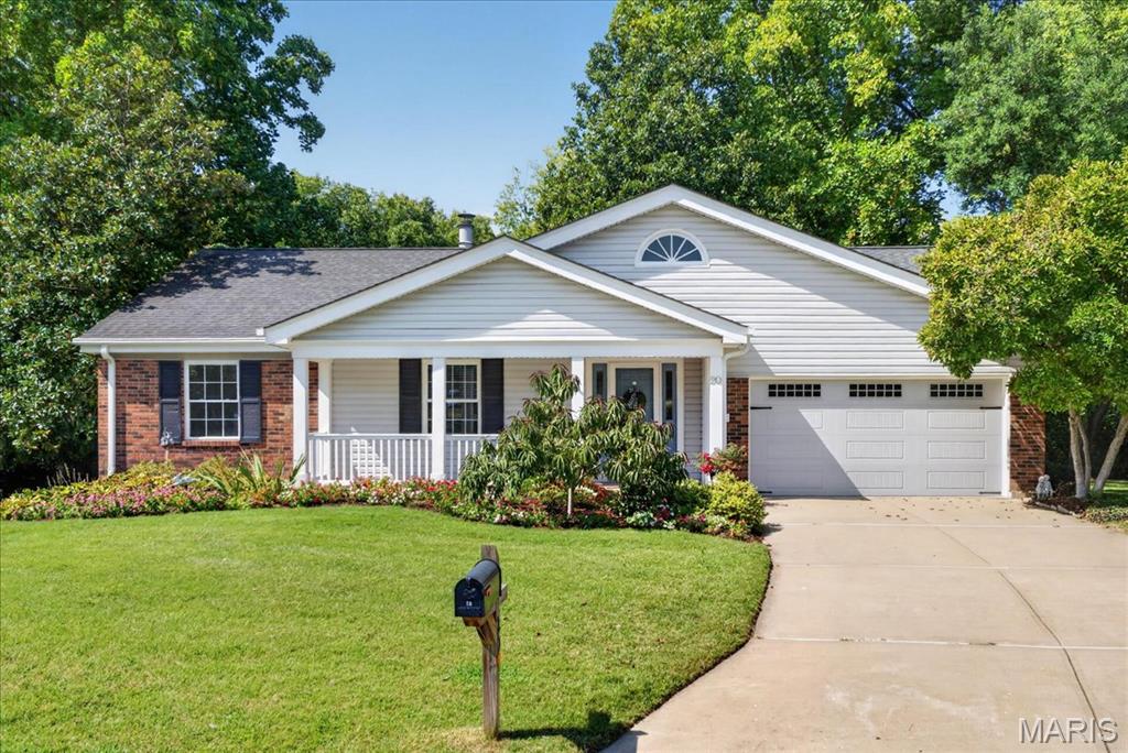 Welcome to 20 Ardennais Road, a lovingly maintained 3-bedroom, 2-bath ranch offering an exceptional opportunity in desirable Drover’s Crossing Subdivision. Tucked on a quiet cul-de-sac and cherished by the same owners for 40 years, this special home is ready for its next chapter. Step inside to a vaulted great room filled with natural light from skylights and anchored by a dramatic floor-to-ceiling stone hearth with gas log insert. Recently added solid oak hardwood flooring flows through the entry, hallway and great room, while the open layout connects seamlessly to the eat-in kitchen. A wall of windows across the back of the home draws your eye outside to what may be this property's most unforgettable feature—an expansive, private and beautifully landscaped .82-acre backyard with inground sprinkler system. A massive deck sits just a few steps above the park-like yard, making indoor-outdoor living effortless. Mature landscaping, an inground sprinkler system, creek access and a walking trail at the rear of the property create a peaceful setting that feels like your own private retreat. Thoughtful features include heated tile floors in the kitchen and primary bath, a newer(2024) Andersen triple-door system to the deck, JennAir downdraft range, an epoxy garage floor, drywalled garage and newer insulated garage door. The open staircase leads to a clean, partially finished lower level with a spacious laundry/craft room, flexible recreation room and abundant unfinished storage. The kitchen refrigerator, washer and dryer, and natural gas grill remain with the home. Homes with this much land, privacy and potential don't come along every day. Move in and enjoy it just as it is, or bring your own ideas and make this longtime-loved home uniquely yours.  Roof-2016, HVAC-2024. Refrigerator, washer and dryer included.