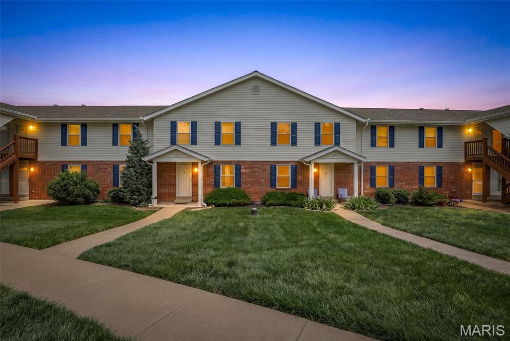 Welcome to this beautifully updated 3 bedroom, 2.5 bathroom townhome featuring over 2000 square feet of living space! The main floor welcomes you in with an open floor plan, neutral paint colors, natural lighting and hardwood flooring. The living area is spacious with a gas fireplace and opens nicely to the dining area and eat-in kitchen which hosts granite counters and breakfast bar, stainless steel appliances and nicely sized pantry. Step outside onto the private deck and enjoy the view! Both upstairs bedrooms are nicely sized with new carpet! The updated hall bathroom with dual vanity sink completes the upper level. The space continues downstairs with the nicely finished walk out lower level, featuring a 3rd bedroom, which can also be the perfect additional family room. Downstairs you will also find another updated full bathroom, large laundry area, storage space and covered patio. New windows (2022 & 2026). New hvac (2021). Assigned & covered parking #89 plus ample additional guest parking.  Enjoy the outdoor pool, common ground areas and all the complex community benefits making home ownership easy and convenient!