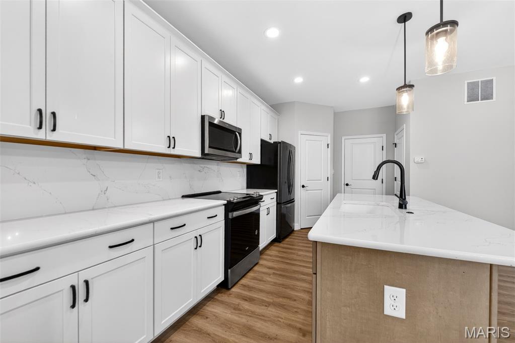 This modern, open floor plan townhome offers 1,474 s/f of stylish, trendy living space with an attached 2 car garage. Featuring 3 BD, 2.5 BA, this luxury townhome by Fischer and Frichtel in Oakleigh Townhomes combines comfort and convenience with upscale finishes throughout.
The spacious interior features 9 ft ceilings, LVP flooring, a main floor Powder Room, 42-inch cabinets with upgraded hardware, soft-close drawers, step-in pantry, island with seating bar, quartz countertops and backsplash, stainless steel appliances, and 2nd floor laundry. The large Primary Suite includes a private bath with comfort-height double bowl vanity and a generous walk-in closet. Two additional nicely sized bedrooms complete the upper level.
Additional features include Low E windows with newer wood slat window coverings, R38 ceiling insulation, Pest Shield system, and lawn irrigation. The exterior showcases brick and board/batten siding, casement windows with modern grid design, architectural shingles, and professional landscaping.
The basement is fully prepped for your custom finishes with a rough-in bath and egress window. Monthly fee covers lawn care, exterior, and landscape maintenance for this all-electric end unit townhome. Located in desirable Francis Howell School District with convenient access to Hwys 94/364/70, restaurants, parks, biking and walking trails, Streets of St. Charles Entertainment District, and St. Louis Lambert International Airport.