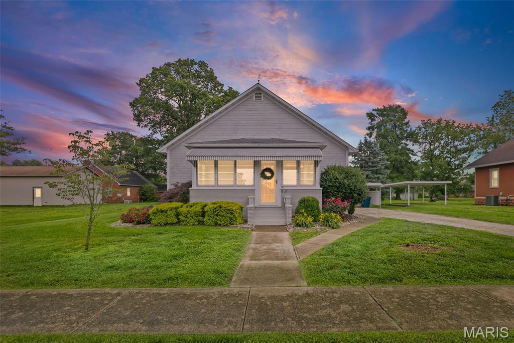 Get ready for your jaw to drop....This cozy home with a classic and simple exterior boasts big surprises inside! Entirely renovated top to bottom, with aesthetically fresh and modern design.  Features include an enclosed front porch seating area, open living room and kitchen with huge peninsula island, 2 spacious bedrooms each with its own walk-in closet, a luxurious bathroom with double vanity, water closet, and walk-in shower. The full basement is unfinished, but very clean and offers over 900 sq. ft. of usable space for additional entertaining, office, or home gym. The covered back patio enjoys a private courtyard for quiet mornings and quaint evenings, with additional back yard space where you could have a large garden. The garage is extra deep with workshop area, loft for storage, and a Tesla charger.  Updates include all new layout, wiring, plumbing, mini-split HVAC units, and interior finishes within the last 6 years. New Anderson windows installed in Dec. 2025. This home is being sold turn-key, as Sellers plan to leave many of the furnishings - ask your agent for more information!