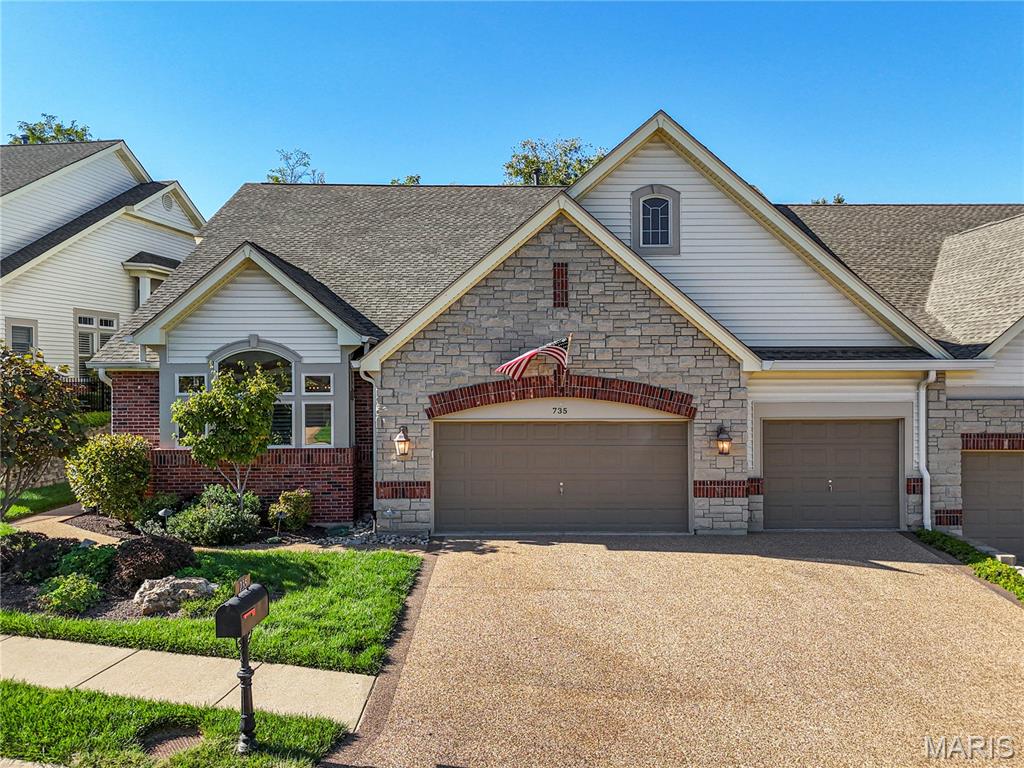 Welcome to this beautifully updated Chesterfield villa, where timeless elegance meets effortless living. Step inside to find a light-filled open floor plan with soaring ceilings, crown molding, plantation shutters, and a cozy gas fireplace surrounded by architectural detail. Andersen doors open to a serene screened-in porch and adjoining deck overlooking the private, tree-lined yard, perfect for quiet mornings or evening entertaining. Designed for both everyday comfort and memorable gatherings, the gourmet kitchen features custom cabinetry, honed granite counters, a Viking gas cooktop, double ovens, Sub-Zero refrigerator, large center island, and a charming breakfast bay framed by plantation shutters. A butler’s pantry with granite counters and walk-in storage adds function and flair. The elegant dining room with coffered ceiling and chandelier creates the perfect setting for hosting in style. The spacious primary suite offers a peaceful retreat with a coffered ceiling, bay window sitting area, French doors, and dual closets. The spa-like bath includes soaking tub, large walk-in shower with stone surround, and double vanities with a makeup counter. The finished walk-out lower level expands the living space with a family room, custom built-ins, wet bar with ice maker, two guest bedrooms, full bath, and a stamped-concrete patio. Additional highlights include a new roof, three-car garage, zoned HVAC, and lush landscaping with lighting—all within a private, 24-hour gated community close to Chesterfield’s best dining, shopping, and parks. Enjoy luxury living with low-maintenance ease, don’t miss out!