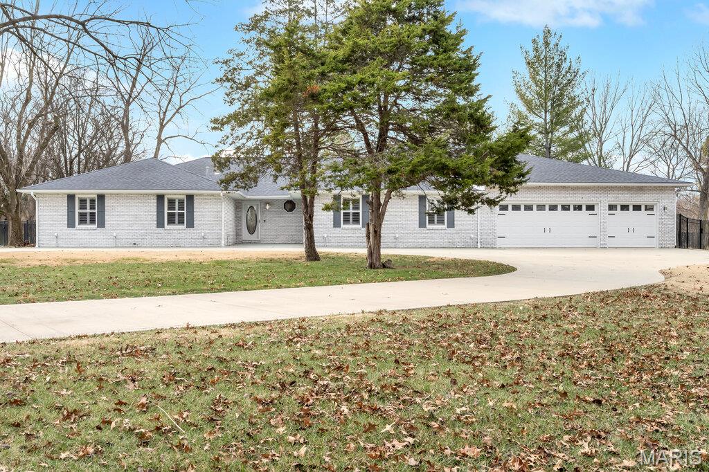 MILLSTADT! Absolutely stunning BRICKRANCH home with over 4,000 Sq. Ft. Finished – all one floor! 3 beds, 4 baths OPEN CONCEPT with massive PRIMARY SUITE WITH WALK IN SHOWER, double sided FIREPLACE. Situated on 3.47 stunning LAKEFRONT ACRES. Fully FENCED back yard with 3 STALL HORSE BARN (or GARDEN SHED). Modern SALT WATER POOL with fully landscaped back yard and NEW GROUND LEVEL SUNDECK. FIREPIT. CIRCLE DRIVE with 3 CAR GARAGE. SOME ACCESSIBLE FEATURES.  MILLSTADT primary SCHOOLS and BELLEVILLE WEST high.

This absolutely stunning all-brick ranch home offers over 4,000 square feet of finished living space, all on one level. With 3 beds and 4 baths, the open-concept design is perfect for entertaining and relaxation. The massive primary suite is a true retreat, featuring architectural curved wall detail, a walk-in closet large enough to store a small car, and a zero-entry double (plus) wide accessible shower – the biggest we have ever seen – for luxury and practicality. The home’s central focal point is a double-sided fireplace, creating warmth and ambiance throughout the main living areas. A wall of windows frames breathtaking views, inviting natural light and year-round scenery, from summer sunsets to snowy winter evenings with hot cocoa by the fire. The combined kitchen (stainless and quartz), dining, living, and flex space, even accommodates the included grand piano and  flow seamlessly together. The separate family room with built-in fireplace and LVP flooring and a den with quadruple French doors leading to the sundeck and pool area provide additional versatility. Bedrooms two and three are generously sized, and baths two, three, and four are well appointed, with the central bath featuring a tub/shower combo.

From the moment you arrive via the circle drive, you’ll know this property is something special. Situated on 3.47 acres of stunning lakefront land, the grounds are fully landscaped and designed for both beauty and function. The backyard is fully fenced, allowing panoramic views and sunsets. Outdoor amenities include a modern saltwater pool with Cooldeck surround, a new ground-level sundeck, a firepit patio, mature trees, raised garden beds, and a three-stall horse barn currently used as a garden shed. The attached three-plus car garage offers ample space for vehicles and toys. The property backs to a shared lake with private stairs and dock access, making it ideal for fishing enthusiasts or those who enjoy wildlife viewing. Every detail of the landscape lends itself to perfect sunsets and breathtaking vistas. This home is a private paradise that feels like a vacation every day.

Luxury, accessibility, natural beauty, and thoughtful design. Whether you’re hosting gatherings by the pool, enjoying quiet evenings by the fire, taking a walk down to the lake or  waking up to serene la views, this property offers the best of all worlds. Who needs a vacation when you can live in a home like this?

ALL visitors must be accompanied by an agent to b anywhere on the property. Video cameras on premises.  Please, no trespassing!