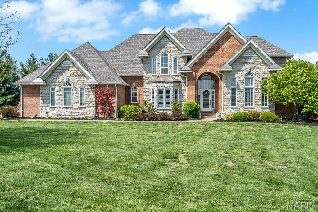 This exceptional 5,300+ sq. ft. executive estate offers luxury living, thoughtful design, and extensive high-end updates on 1.36 acres in one of Columbia’s most desirable no-HOA subdivisions. Recent exterior upgrades include a brand-new roof with copper flashings, select new windows, and updated gutters and downspouts. Inside, a dramatic two-story foyer with hand-cut marble tile leads to radiant-heated flooring throughout the main level, a private office, and a stunning two-story living room with arched transom windows, new flooring, and a wood-burning fireplace with walkout to the pool deck. 

The fully remodeled gourmet kitchen features an oversized island, Cambria countertops, farmhouse sink, secondary vegetable sink with induction cooktop, double ovens, two dishwashers, designer lighting, and a custom butler’s pantry, plus a beverage station. The main-level primary suite offers French doors to the pool, a massive custom closet, and a spa-style ensuite with jetted tub, walk-in shower, dual vanities, and private powder room. Upstairs are three spacious bedrooms, including a second suite, plus a Jack-and-Jill bath.

The finished lower level adds a large family room, custom bar, game/recreation areas, oversized gym, full bath, and an additional bedroom. Outdoor living is resort-quality with a saltwater pool, pergola-covered patio, hot tub, new oversized pool shed, and extensive stone paver areas. A rare combination of scale, craftsmanship, and amenities—this home truly has it all.