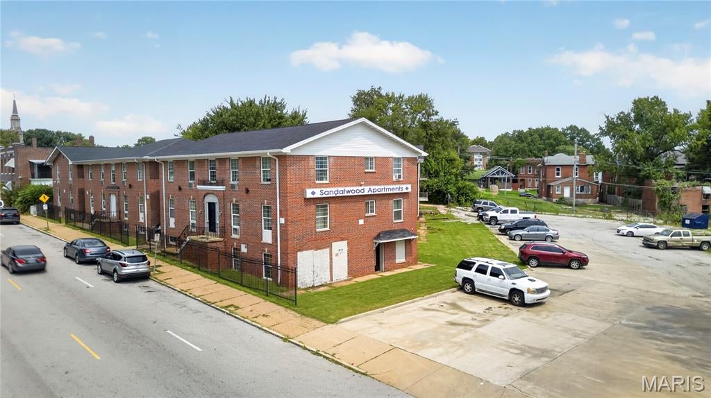 Sandalwood Apartments is a 41-unit, garden-style multifamily community at 8404 Halls Ferry Road in the established Baden neighborhood of north St. Louis City. Built in 1964, the asset comprises five brick buildings on a 1.316-acre site with 25 surface parking spaces, offering an all one-bedroom/one-bathroom unit mix that appeals to the area’s steady renter base.

Occupancy recovery –

The offering represents a compelling occupancy-recovery story. Following a January 2025 fire and a substantial redevelopment of the affected units, the property has returned to stabilized performance: the June 2026 tenant roster documents 40 of 41 units leased – 97.6% occupancy – at in-place rents of $700 to $750 per month. That recovery reverses the 2022-2024 downtrend and re-establishes durable in-place cash flow, with in-place rents sitting at or slightly above the Baden submarket asking benchmark.

At the proposed list price of $1,999,000, or $47,595 per unit, Sandalwood delivers an 10.95% in-place cap rate on a stabilized net operating income of $218,952.40 and a gross rent multiplier of 5.72x. The per-unit basis sits within the confirmed non-distressed comparable range of $30,952 to $66,500 in the submarket – below the recent high – and is supported by the property’s restored occupancy and demonstrated cash flow rather than a speculative turnaround.

The Baden location offers strong fundamentals: frontage on Halls Ferry Road carries 18,787 vehicles per day on a primary north St. Louis City corridor, with roughly 15 minutes to Lambert International Airport and convenient access to regional commuter rail. Zoning is F – Neighborhood Commercial.

Sandalwood is well-positioned for stabilized-income buyers, portfolio acquirers, and 1031 exchange investors seeking cash-flowing multifamily in the St. Louis market. The property is offered on an all-cash, 1031 exchange, or portfolio basis, providing acquisition flexibility across a range of buyer profiles.
