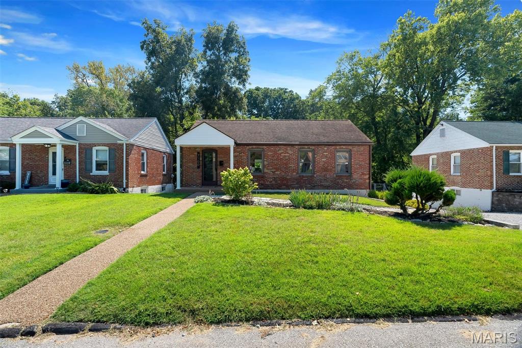 Meticulously maintained and freshly updated, painted in the latest, color drenched, style and fitted out in matte black hardware, this 2 Bed, 1 Bath, Brick Ranch has everything you need and so much more! The landscaped walkway leads you into the open Living room and Dining Room with a kitchen peninsula, perfect for entertaining! Moving through the galley style kitchen, you will find the HUGE, 300+ SQFT ADDITION that can be whatever you need it to be! Family room, home office space, homework space, craft space, any or all of these and more! Step out of the Addition and onto the 2 level, 180+ sqft deck, that backs to trees and overlooking a flowing creek. This Peaceful Oasis is nestled on a quiet, tree lined street, in the Village of Mackenzie with Mackenzie Park a 5 minute walk down the street, and in the sought after Affton school district but still just minutes to the best attractions and dining St. Louis has to offer. Welcome home!
