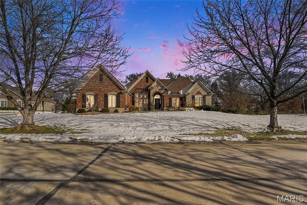 Looking for your dream home in highly sought-after Cottleville? This stunning custom-built 4-bedroom, 3.5-bath ranch is perfectly situated on a beautiful 1-acre lot, offering privacy, luxury, and exceptional indoor-outdoor living. The spacious main level features a luxurious primary suite highlighted by coffered ceilings, a custom 7’ x 15’ walk-in closet, and an elegant en suite bath complete with a steam shower. Two additional generously sized bedrooms, each with walk-in closets, complete the main level. Step outside from the breakfast nook to a spacious deck with a 12’ x 14’ screened porch, ideal for morning coffee or relaxing evenings. The finished walk-out lower level is ideal for entertaining, offering a full custom bar from the 1904 Worlds Fair, a 4th bedroom, and a full bath, creating the perfect space for guests or extended living. Step outside and escape to your private backyard oasis, where you’ll enjoy a custom-designed saltwater pool and a bocce ball court, all surrounded by serene, picturesque views—perfect for relaxing or hosting unforgettable gatherings.
This exceptional home combines luxury, comfort, and lifestyle in one of the area’s most desirable locations.