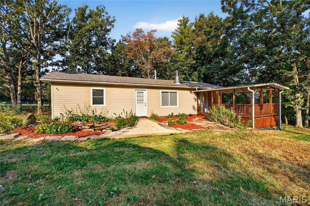 Are you looking for a nice home on 15 acres with a WOW shop building?!!  Come look at this property!  Nicely updated 3 bedroom ranch home with a nice open floor plan.  Beautiful kitchen with room for an island, plenty of cabinets and lots of windows for natural light.  Mini splits for heat and air plus a freestanding wood stove in the living room.  Covered porch to enjoy the outdoors and a neat little koi pond!  Then you have the shop building....it's a Worldwide steel building, 60X30 with 14' ceilings and 3 doors, concrete floors, insulation, floor drain and electric built in 2022.  Roof was done in 2021.  Several small outbuildings.  Rolla Schools!
