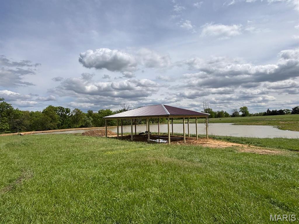 Location, Location, Location. Are you looking for an UNRESTRICTED acreage close to Mark Twain Lake? If so, then look no further. This property is located within minutes of the Jellystone Park, Water Zone, Spalding Recreation Area and Beach, Clarence Cannon Dam, Warren G. See Spillway, Ray Behrens Recreation Area, Blackjack Marina, restaurants and more. If you need to grab a few necessities or don't feel like cooking, the City of Monroe City is less than 15 minutes away. This amazing lot is mostly flat with some trees and would be perfect for your dream home. With a private pavilion and shared lake with a beach this 6.64 acre lot is the PERFECT lake location. Don't miss this rare opportunity to own a piece of paradise at Mark Twain Lake.