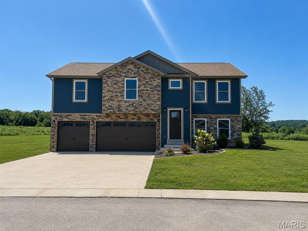 This beautiful 5-bedroom, 3-bath home, built in 2023, offers modern style, quality finishes, and breathtaking country views. The open floor plan features vaulted ceilings, luxury vinyl plank flooring, recessed lighting, and a spacious eat-in kitchen with shaker-style cabinetry, ample counter space, solid surface countertops, and stainless steel appliances. The primary suite includes a walk-in closet and private bath with a walk-in shower. The finished lower level offers additional living space, a full bath, and two additional bedrooms, perfect for guests, a home office, or a growing family. Step outside onto the back deck and take in the breathtaking panoramic views of rolling hills and open countryside. Additional features include a spacious 3-car attached garage, public utilities, and a level backyard with plenty of room to entertain or play.  Conveniently located just south of Potosi, this move-in ready home combines peaceful country scenery with modern comfort. Schedule your private showing today!