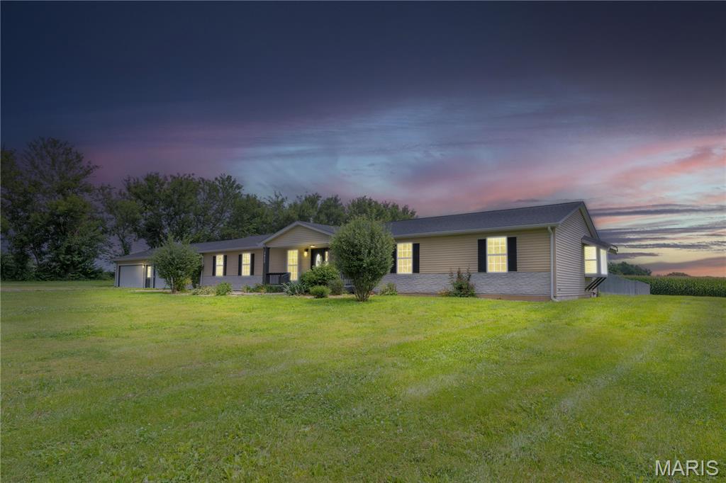 Experience the perfect blend of luxury, comfort, and privacy in this stunning 4-bedroom, 3.5-bath home situated on approximately 2 peaceful acres just outside of Edwardsville. Tucked away at the end of a quiet road, this property offers the seclusion you've been looking for while remaining just minutes from shopping, dining, SIUE, and everyday conveniences.
Step inside to an inviting open floor plan designed for both everyday living and effortless entertaining. The spacious living areas are highlighted by two electric fireplaces, creating warm and welcoming spaces to gather with family and friends.
The chef-inspired kitchen is truly the heart of the home, featuring gorgeous granite countertops, a large center island with ample seating and prep space, stainless steel appliances, abundant cabinetry, and an open flow into the dining and living areas—perfect for hosting or enjoying everyday meals.
The thoughtfully designed split-bedroom layout provides exceptional privacy, with the primary suite located on the opposite side of the home from the additional bedrooms. The spacious primary retreat offers a peaceful escape, while each secondary bedroom features its own private bathroom, providing comfort and convenience for family members or guests.
Outside, you'll enjoy approximately 2 acres of beautiful property, including a fenced backyard that's ideal for pets, children, or outdoor entertaining. A storage shed located beside the home provides additional space for lawn equipment, tools, or recreational gear. The front yard is enhanced by a variety of fruit trees planted in October 2023, adding beauty, seasonal blooms, and the promise of future harvests.
Additional highlights include dual-zone climate control for year-round comfort, a spacious 4-car attached garage with plenty of room for vehicles, storage, and hobbies.
This exceptional property offers the perfect combination of modern amenities, thoughtful design, and peaceful country living just outside of Edwardsville. With spacious living areas, premium finishes, and room to enjoy both indoors and out, this one truly checks all the boxes. Edwardsville School District.