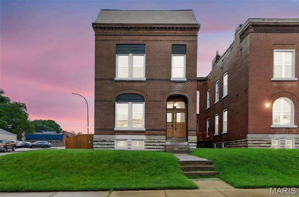 Beautifully restored 3-bedroom, 2.5-bath home blending historic charm with modern updates. Features include 10-foot ceilings, exposed brick, original wood trim, updated major systems, zoned HVAC, and TPO roof. The open main level offers a spacious living room, half bath, and renovated kitchen with quartz countertops, stainless steel appliances, and new flooring. Upstairs features generous bedrooms, ample closets, and a private primary suite with a double vanity and custom-tiled shower. Move-in ready!