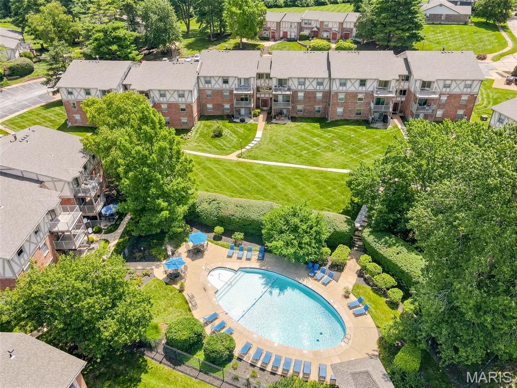 At $155,000, this 2-bedroom, 1.5-bath condo is proof that affordable does not have to mean boring. With 910 square feet of bright, easy living space, this home gives you the things buyers actually care about: a clean layout, good natural light, in-unit laundry, a private balcony, and a kitchen that doesn’t make you immediately start pricing renovations.

The main living area feels open and comfortable, with light flooring, neutral walls, crown molding, and sliding doors that lead out to a balcony overlooking mature trees perfect for an evening reset, or pretending you are the kind of person who keeps plants alive. The kitchen offers warm cabinetry, stainless steel appliances, a gas range, black countertops, and a modern island that adds extra prep space, storage, and a natural spot for casual meals.

Both bedrooms are nicely sized, and the layout adds everyday convenience. The in-unit laundry is tucked away right where you need it, no hauling baskets across a parking lot, which is always a win.

Located in the 63146 zip code, this condo also brings strong lifestyle value with a convenient commuting location and access to a community pool that is a must see. Whether you are buying your first place, simplifying your lifestyle, or looking for a smart affordable option makes this choice feel practical, comfortable, and honestly pretty refreshing.