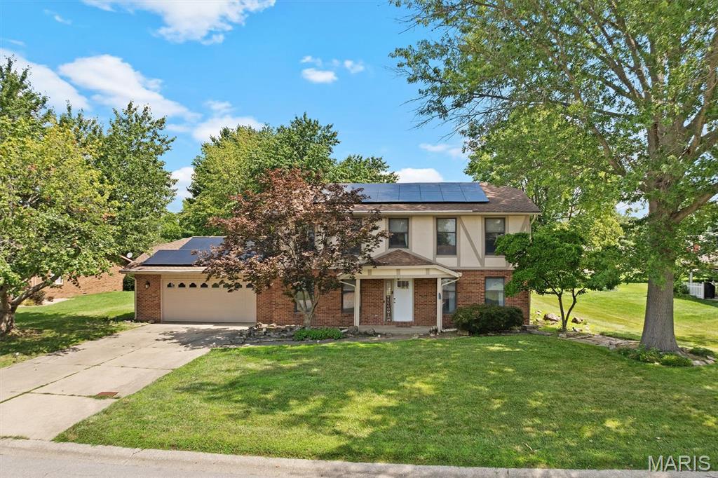 Calling all golf enthusiasts! This handsome two-story, four-bedroom home, located in a desirable golf course community, may be just what you've been searching for. Designed for comfortable living and entertaining, the home features a spacious living room separate from the formal dining room. The inviting family room showcases a brick woodburning fireplace, creating a warm gathering space. The efficiently designed kitchen offers ample cabinetry, durable solid-surface countertops, and stainless steel appliances. Upstairs, the spacious primary suite features a private bath with a jetted tub and separate shower. Three additional generously sized bedrooms and a full guest bath complete the upper level. Enjoy year-round relaxation in the glass-enclosed porch overlooking the backyard, or step outside to the covered patio, perfect for grilling and outdoor entertaining. Conveniently located near shopping, restaurants, schools, and interstate access. Leased solar panels help improve energy efficiency. Don't miss this opportunity to own a beautiful home in an established golf course community!