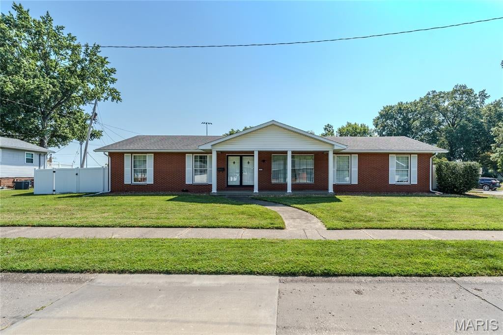 Welcome to this all-brick ranch home offering plenty of space and potential in a convenient Granite City location! This home features 3 bedrooms and 2 full bathrooms, along with multiple living areas that provide room for everyone. Enjoy a spacious living room, separate dining room, kitchen, and family room featuring a cozy fireplace. The full basement offers an abundance of additional space and is ready for a new owner to finish to fit their needs—whether that's additional living space, a recreation room, home office, or extra storage. Outside, you'll find a fenced backyard perfect for relaxing, entertaining, pets, or play, along with an attached 2-car garage for added convenience. Located near schools and a wonderful neighborhood park, this solid brick ranch offers a great opportunity to make updates and truly make it your own. With a functional floor plan, generous living space, full basement, and desirable location, this home has so much potential!