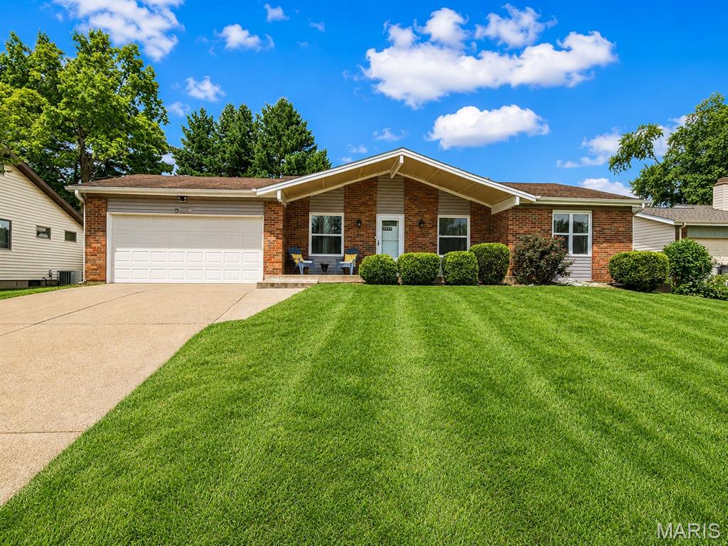 Welcome home to this charming, sun-drenched ranch where your family can grow, laugh, and make memories for years to come. Nestled in a quiet, sidewalk-lined neighborhood, this 3-bedroom, 2-bathroom home features a classic brick front and an open layout that keeps everyone connected, whether you are making breakfast at the bar or hosting movie night in the spacious living room. The heart of the home opens up to a fully fenced, private backyard, perfect for weekend barbecues, a playground set, or watching your kids and pets play safely. For even more space, the partially finished basement is ready to become the ultimate playroom, teenager hangout, or cozy family den. Parents will love the privacy of the primary bedroom suite, while the two additional bedrooms offer the perfect setup for nurseries, kids' rooms, or a dedicated home office. Outside your front door, your family will enjoy an active, outdoor-loving lifestyle with incredible community parks just a short stroll away: White Birch Park: Steps away, featuring open green spaces for family picnics and playgrounds. White Birch Bay Aquatic Center: A local favorite for cooling off on hot summer afternoons. Harry S. Truman Park: Features a peaceful fishing pond and walking trails for evening family strolls.