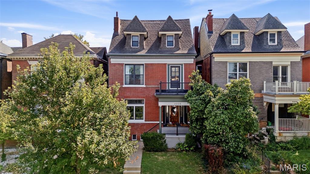 OPEN SUNDAY 1–3!  Welcome to this stately, spacious 4+ bedroom home offering over 2,900 square feet of living space in the vibrant and historic Shaw neighborhood. With generously sized rooms throughout and a flexible floor plan, this home offers incredible versatility for the way you live, work, and entertain.  From the moment you step inside, you’ll be impressed by the character, scale, and flow. To the left, the living room features a beautiful original fireplace with mantel, exposed brick, and a full wall of built-ins—an inviting space filled with charm. Straight ahead, you’ll find a flexible area ideal for a mudroom, walkthrough office, or creative drop zone. The layout continues seamlessly into an additional living space, giving you room to spread out. The updated kitchen checks all the boxes with stainless steel appliances, a double sink, abundant cabinet space, solid surface counters, and a beautiful backsplash.

Upstairs, there is truly a room for everyone. Need bedrooms, multiple offices, a nursery, workout room, guest space, or hobby room? This home has you covered. The primary suite is a true standout—large enough to do running cartwheels in—with an attached sitting room and fireplace, creating the perfect private retreat to escape and unwind. A bonus room above the stairs offers access to the front balcony and would make a wonderful office, nursery, yoga room, or reading nook. The large second bedroom on this level is filled with natural light & spacious too!  The 2nd FULL hallway bathroom is updated, stylish & CHIC!!!!  You'll love how modern it is!  And surprise—there is also a convenient second-floor LAUNDRY ROOM in the rear that rounds off the 2nd floor!  

The third floor will continue to grab your attention!  Normal ceiling height and no awkward low slanted walls or ceilings here.  You’ll find two more generously sized bedrooms plus a THIRD FULL bathroom, making this level both functional and comfortable.

Outdoor space is just as impressive, with front and rear balconies, a large main deck, and a fenced-in private yard—perfect for relaxing, entertaining, or enjoying a little fresh air. Bonus: two parking spaces!

You’ll give this home five stars for location, too. Walk to schools, Botanical Garden, Tower Grove Park, the farmers market, Sasha’s, Tee Rays, Ices Plain & Fancy, Fiddlehead Fern Cafe, and so much more. Plus, the culinary treasures of South Grand are just a hop away. Neighborhood Dog Park is also on this street one block down! Commuting is easy with quick access to 44, 40/64, 55, and 270 from here. Homes in Shaw are in high demand and low supply—especially homes of this size. This is a true gem offering space, character, flexibility, unbeatable location & it's priced to catch your attention! Don’t miss it!