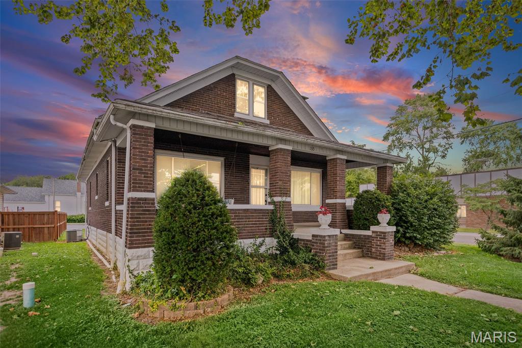 Welcome home to this charming bungalow, perfectly situated on a desirable corner lot and full of timeless character! Start your mornings or unwind in the evenings on the inviting front porch, the perfect spot to relax and enjoy the neighborhood. Inside, you'll find an open living and dining room filled with warmth and charm, featuring a cozy fireplace with gas available that creates the perfect gathering space. The main level also offers a full bathroom and a well-appointed kitchen with upgraded appliances, making meal preparation a breeze. Upstairs, you'll find two additional bedrooms that offer great potential and simply need new flooring to make them your own.
The finished basement provides even more living space with a spacious second family room complete with a wet bar—ideal for entertaining or hosting game nights. You'll also appreciate the unfinished storage area with a toilet already in place, offering an excellent opportunity to create an additional bathroom. The laundry room includes the washer and dryer, which will remain with the home. Step outside to the private back patio, a wonderful space for relaxing, grilling, or enjoying time with family and friends. Completing the property is a detached garage, adding convenience and extra storage. With its classic bungalow charm, spacious living areas, thoughtful updates, and room to add your personal finishing touches, this home is ready to welcome its next owner!  Schedule your appointment today before its gone!