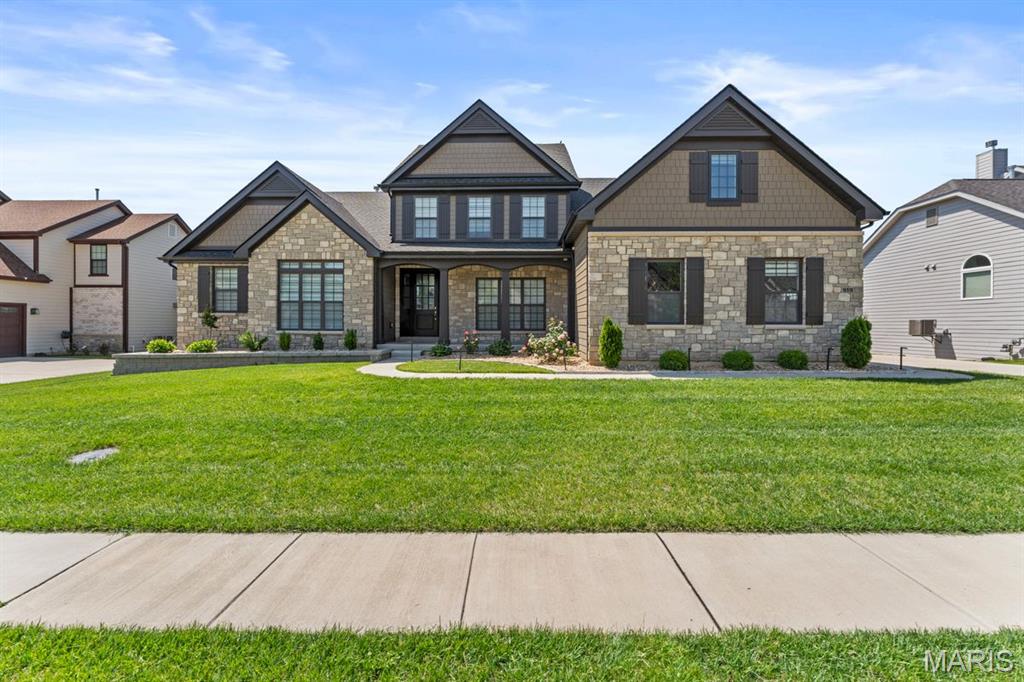 Homes of this caliber and level of finish, built as recently as 2023, rarely become available in Chesterfield, especially within the sought after Fienup Farms subdivision off Wild Horse Creek. Offering over 6,700 square feet, this residence presents a true opportunity to secure newer construction without the time, cost, or compromise of building. A striking interior unfolds with clean architectural lines, refined finishes, and a chef’s kitchen anchored by Wolf appliances, seamlessly connecting to the main living spaces. The layout is thoughtfully designed with a luxurious main floor primary suite, complemented by a private secondary ensuite on the opposite wing, ideal for guests or multigenerational living. A private office and formal dining room are positioned with intention, enhancing functionality while maintaining a seamless flow throughout the home. Upstairs, three spacious bedrooms and a generous bonus room provide flexible living and gathering spaces. The finished lower level expands the experience with extensive recreation areas and direct walkout access to an expansive patio. Outdoor living is equally considered, with a covered deck offering privacy and a relaxed setting overlooking the level backyard, well suited for a pool or curated outdoor living environment. A three car side entry garage completes the offering. For the buyer seeking newer construction without compromise, in one of Chesterfield’s most desirable settings, this is a rare and complete opportunity.