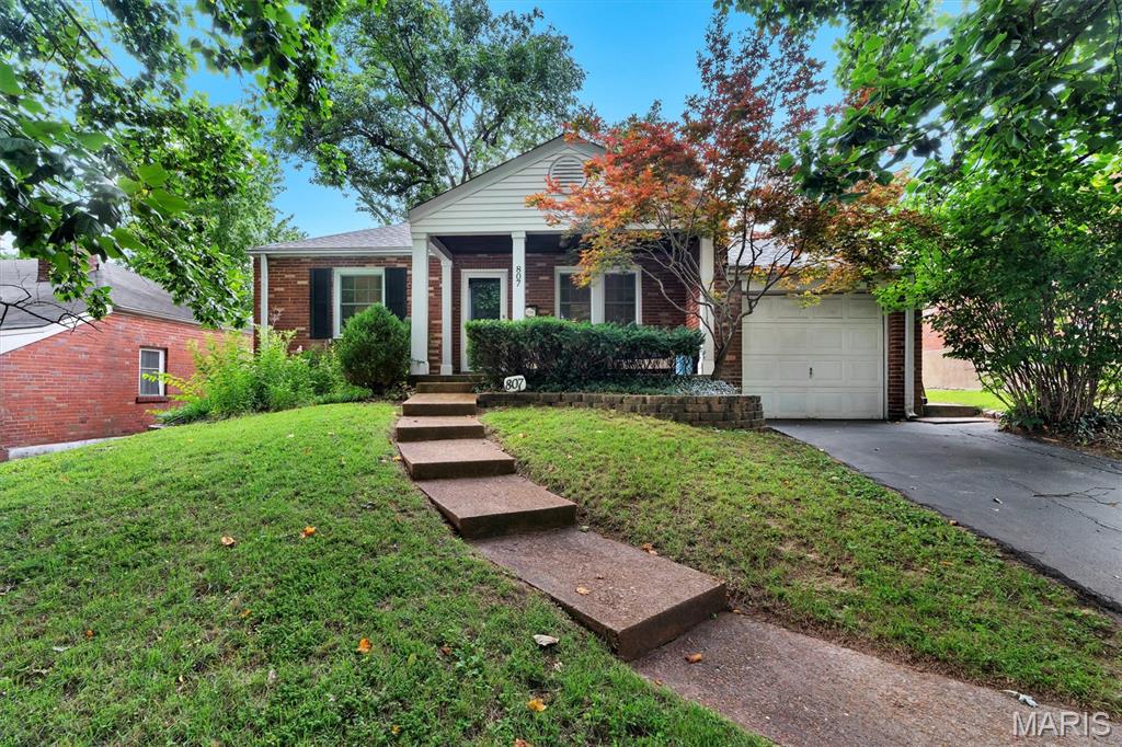Welcome home to 807 Blossom Lane a charming all brick 2 bedroom, 1 bath home with a one-car attached garage in the heart of Rock Hill! From the welcoming covered front porch to the private backyard deck, this home offers the perfect blend of character, comfort, and convenience. Inside you’ll find beautiful hardwood floors, classic arched doorways, abundant natural light, and a spacious family room with a cozy fireplace. The updated kitchen features crisp white cabinetry, stainless steel appliances, sleek countertops, and flows seamlessly into the dining room ideal for everyday living and entertaining. Two generously sized bedrooms and an updated full bath featuring a newly reglazed tub and shower complete the main level. Step outside to enjoy the backyard deck overlooking a peaceful backyard, perfect for relaxing or entertaining. Conveniently located in the heart of Rock Hill, you’ll enjoy easy access to parks, shopping, dining, schools, and major highways. Move-in ready and full of charm, this is one you won’t want to miss!