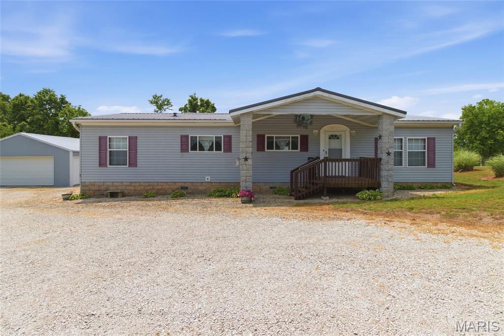 Charming 3-bedroom, 2 bath manufactured home situated on 3.27 peaceful acres just 5 miles south of Mountain Grove, MO. This property offers the perfect blend of country living and convenience. Features include a spacious 24x24 detached 2-car garage, a screened-in back porch ideal for relaxing or entertaining, and plenty of room to enjoy the outdoors. Low taxes add to the appeal of this affordable and move-in ready property. Enjoy the quiet rural setting while still being close to town amenities. Call today!