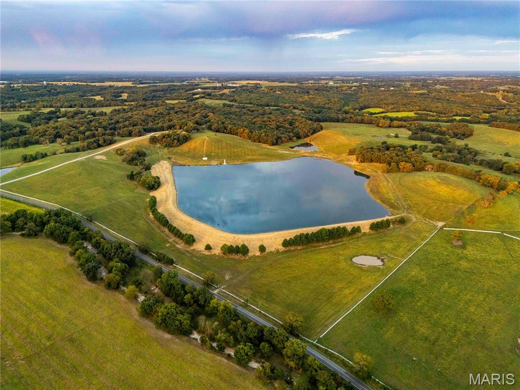 This remarkable 106± acre property is nestled in the heart of Southern Pike County, a rare gem for potential primary residence or weekend getaway. The estate is located on Highway D just north of Eolia, MO, one of the most sought-after locations in this part of Pike County. Tremendous views of the Pike County Knobs.

World-class FISHING on a private 30± ACRE stocked lake. The lake features a boathouse, ramp, and dock. Whether you’re considering a weekend home, hunting lodge, or family compound, the property offers several perfect building sites with electric and county water available. 

Plenty of entertainment for the non-hunters as well, from swimming or boating on the lake, horseback riding, hiking, or riding ATVs. This property offers complete tranquility while remaining highly accessible and secure. Paved highway from St. Louis to the entrance of property.  Top-notch in an area known for its pristine natural beauty, located less than 40 min from Wentzville.  A recreational paradise at its finest located less than 40 min from Wentzville. 

Additional land available.  Owner/Agent