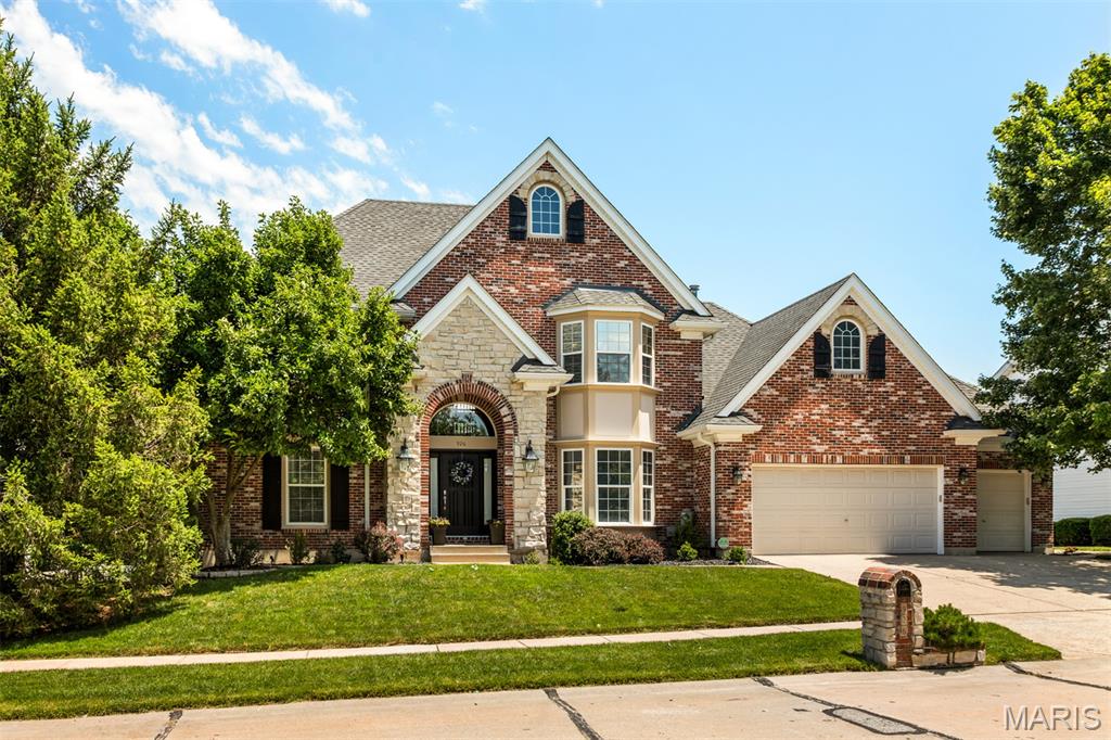 This stunning home has been thoughtfully updated throughout, offering all the modern amenities today's buyers desire. The exterior features an elegant stone and brick facade that sets the tone for what lies inside. Step into the impressive two-story foyer that opens to a bright and spacious great room, highlighted by a wall of windows and a cozy gas fireplace. Enjoy seamless indoor-outdoor living with access to a large deck overlooking a sparkling inground pool.

The main floor primary suite boasts a luxurious, updated bathroom complete with a double vanity, walk-in closet, a beautifully tiled shower, and a soaking tub. The kitchen and breakfast area feature newer granite countertops, a stylish tile backsplash, white cabinetry with crown molding, and stainless steel appliances, including the refrigerator. Hardwood floors flow gracefully through the foyer, dining room, and kitchen/breakfast area. Convenient main floor laundry with included washer and dryer is located just off the kitchen. The updated powder room is a standout jewel, centrally located within the home.

The formal dining room impresses with a tray ceiling and a bay window, perfect for entertaining. Upstairs, you will find three bedrooms: two share a Jack & Jill bathroom, while the third has a private ensuite. All bathrooms have been recently renovated, and wood flooring extends throughout the upper level, excluding the bathrooms. An expansive storage closet adds valuable space.

The lower level is partially finished and includes a beautiful walk-behind bar with extensive cabinetry, a wine rack, granite counters, a sink, and a tile backsplash. Built-in nooks provide storage and display space for decor and electronics. This level also features a full bathroom, an office or guest room, and unfinished storage areas. The walk-out lower-level leads to a patio with a gazebo, offering a shaded retreat by the pool.

The spacious deck is enhanced with decorative iron spindles and provides access to the patio, kitchen, and great room. It wraps around to the side of the home, connecting to a sidewalk leading to the driveway. Additional updates include a painted and drywalled garage with a finished floor, a new HVAC system installed in 2020, fresh paint throughout, updated lighting fixtures, new carpet 5/26 and a new front door. Enjoy this fabulous Crown Pointe neighborhood located steps from the Rock Hollow Trail.    Easy access to great shopping, dining and major St. Louis highways!