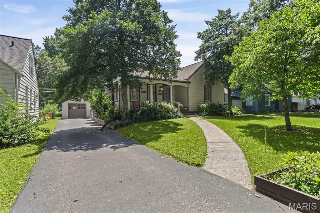 1930s charming cottage with white kitchen with appliances ( gas stove frig dishwasher). Gorgeous tiled surround fireplace.  Built in corner China cabinets in dining room. Solid hardwood floors.  Tons of closet space.  Upper level suite with bathroom with shower.  Family room plus bar area in basement with knotty pine walls. Private rear deck and detached garage.  Move on ready. City compliant.  Please note: Audio and video surveillance are in use on this property. Buyers & Buyer’s agents are responsible for verifying accuracy of all MLS data.