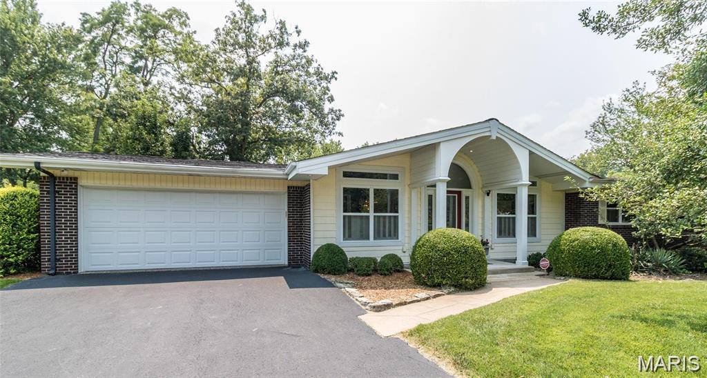 Live the Mid Century dream! This 3-bedroom, 2.5-bath show stopper is the perfect blend of classic charm and modern updates. The main floor boasts newer hardwood floors, updated appliances, and a completely renovated primary bath. This immaculate gem also has recent updates for your comfort and peace of mind, including new HVAC in 2022, additional concrete pad/patio, new ceiling fans and a new retaining wall. The location is perfect with a gorgeous wrap around yard on a corner lot that goes into a cul-de-sac.  A peaceful and inviting outdoor space combined with easy access to Hwy 141 and everywhere you need to be. The cherry on top - the finished lower level invites you into a one-of-a-kind "speakeasy" vibe - perfect for entertaining a crowd, a family movie/game night or simply your own private retreat. This home is truly a "must see"!