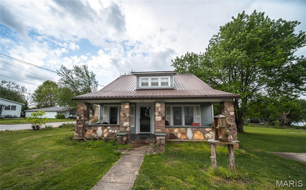 Charming 3-bedroom, 2-bath bungalow full of character and timeless appeal. The main level features beautiful wood flooring in the living and dining rooms, creating a warm and inviting atmosphere. A spacious kitchen offers abundant counter space and cabinetry, perfect for everyday living and entertaining, along with classic built-ins that add both charm and functionality.

Enjoy relaxing on the covered front porch or spending time on the back deck overlooking the yard. Situated on a desirable corner lot, this property offers additional space and curb appeal. This home is being sold as-is and presents a great opportunity for buyers looking to add their own personal touch while enjoying the character and charm this bungalow has to offer.