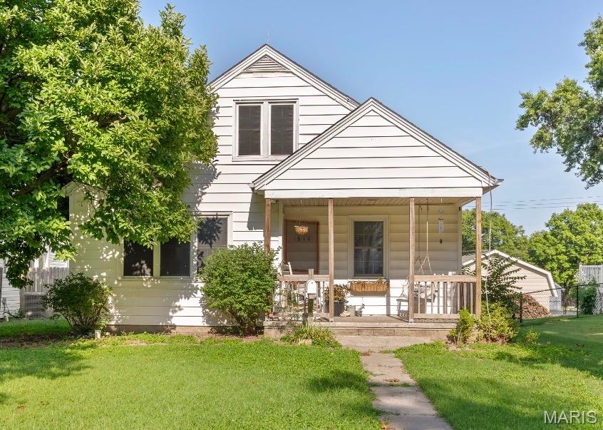 Charming 3-bed, 1-bath cottage in the heart of Red Bud — walking distance to local schools. Main floor features two bedrooms and a full bath; an updated bedroom is located upstairs. Updated kitchen opens to a cozy living room and dining area with a coffee bar/dry bar off to the side. Full, unfinished basement offers great storage or future finished space. Large fenced backyard and detached garage at the rear of the property! Schedule a showing today!