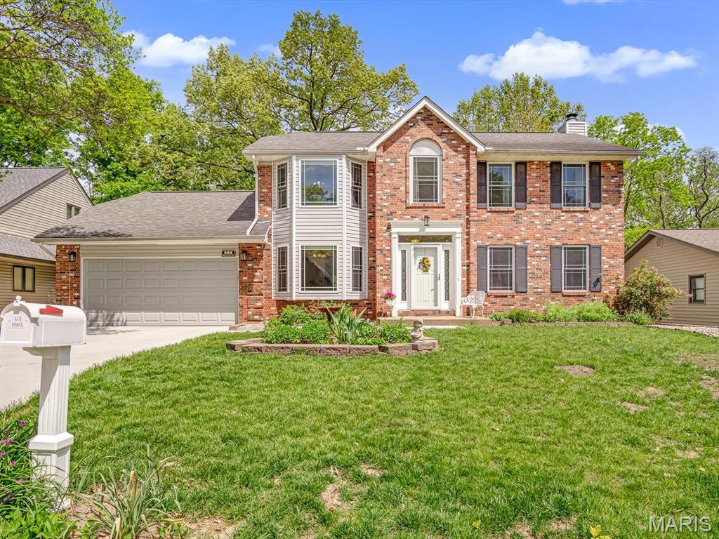 Impeccably maintained, one owner two story home conveniently located on the north end of town.  Featuring 4 beds and 3 baths, with beautiful hard wood flooring throughout.  Upon arrival you will notice a new concrete driveway and walkway (2025) that leads you to the welcoming foyer.  Enjoy cozy days & nights by the brick surround, wood burning fireplace or head out to enjoy the sunlight in the sunroom equipped with its own heating/cooling system or the maintenance free deck (2013).  Meals can be easily prepared in the spacious kitchen that boasts granite counter tops and newer appliances while a beautiful bay window illuminates the dining room.  The laundry room and a half bath round out the main level.  The primary suite is located at the top of the staircase and has been redone (2010) with jetted, soaking tub, a separate walk-in shower and double vanity. The primary bedroom showcases a bay window and large walk-in closets.  The remaining 3 bedrooms are on the other side of the hallway with a full bathroom completing the second level.  The partially finished walk-out basement adds additional living space and an abundance of storage.  It will bring peace of mind to know that major items have been addressed - Furnace (2020), AC (2018), Gutterguards (2017), and new roof (2018.)  All that is left to do is move in and enjoy!