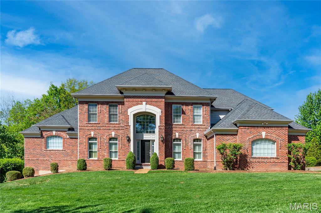 Stunning 1.5-story custom home in the highly sought-after, award-winning Rockwood School District, Lafayette high school. Step into a dramatic two-story entry foyer featuring elegant marble-look tile flooring, flanked by a formal dining room and private home office. The impressive two-story great room showcases expansive windows overlooking a beautifully leveled, tree-lined backyard, filling the space with natural light. Step outside onto the spacious cedar deck—perfect for relaxing or entertaining in a private outdoor setting. A wet bar in the great room adds extra convenience for hosting. The heart of the home features an open and inviting layout combining the chef’s kitchen, hearth room, and breakfast area. This space is surrounded by 12 windows, offering stunning views of the beautifully landscaped backyard with mature trees and seasonal flowers, and filling the home with abundant natural light. The kitchen includes granite countertops, custom cabinetry, an oversized center island, stainless steel appliances, and a built-in desk. The adjoining hearth room features a cozy wood-burning fireplace, creating a warm and welcoming atmosphere for everyday living. A powder room and main-floor laundry add everyday convenience.
The luxurious main-floor primary suite offers a bay window with serene, tree-lined views for added privacy, a cozy sitting area, and a spa-like bath featuring a jetted tub, dual vanities, separate shower with custom tile work, and a walk-in closet. Upstairs, you’ll find three spacious bedrooms, each with its own full bath. One bedroom has been thoughtfully converted into a dream dressing room and can easily be returned to a bedroom if desired.
The finished walk-out lower level offers exceptional space and versatility, ideal for both everyday living and entertaining. It features a spacious recreation area with a stunning wood-burning stone fireplace and a well-appointed secondary kitchen complete with custom cabinetry, granite countertops, and built-in oven and microwave.
This level also includes a large bedroom with a built-in desk, a generously sized fitness area with two large mirrors and built-in shelving, and an expansive media room—each thoughtfully designed with comfort and functionality in mind. A full bath and three oversized storage rooms further enhance the practicality of this level.
Additional highlights include an oversized 3-car side-entry garage and a prime location near Chesterfield Parkway, with quick access to Interstate 64 and close proximity to shopping and dining in Chesterfield Valley and Boone’s Crossing. Ordered replacement window for kitchen,  The entire master bedroom bay windows to be installed upon arrival(in 3-4 weeks), Buyer can purchase with confidence with all previously identified inspection items have been completed. Seller will credit buyer $2500 for deck.