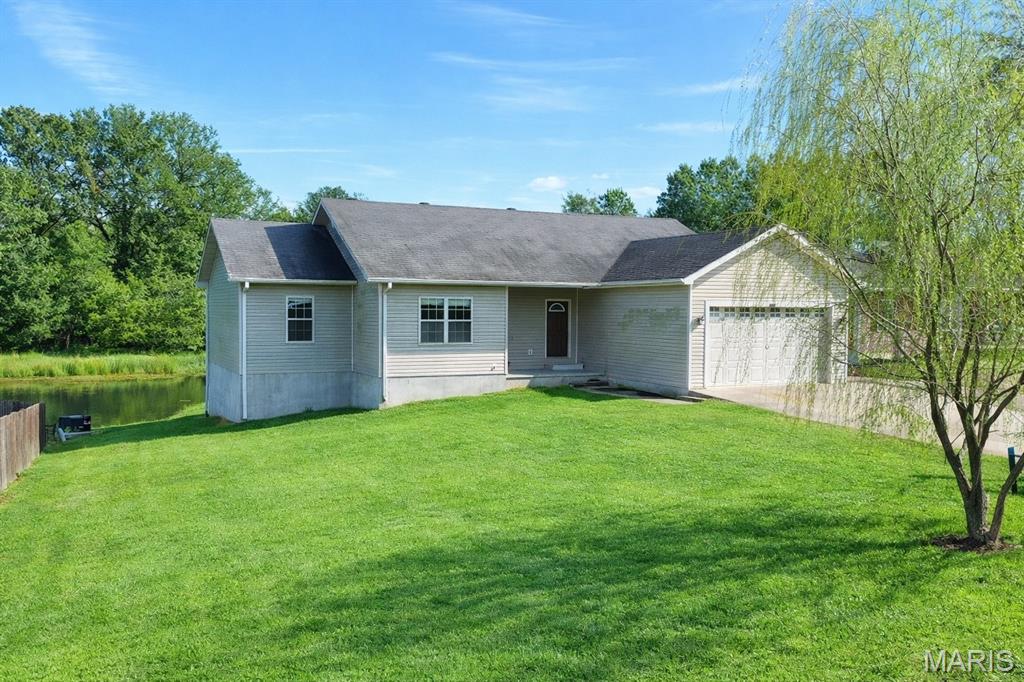 Welcome home to this beautifully designed 4-bedroom, 3-bath residence located in a highly sought-after subdivision. This home offers a spacious and functional layout featuring walk-in closets, tiled walk-in showers, and a finished walkout basement perfect for entertaining, relaxing, or multi-generational living. Step outside to enjoy peaceful views of the backyard pond, creating a serene retreat right at home. Combining comfort, style, and an ideal location, this home checks every box.