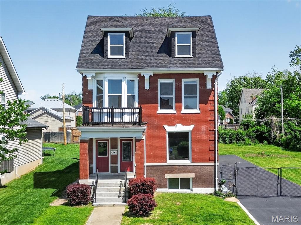 Step into timeless character with modern luxury in this stunning 2.5 story brick home, originally built in 1908 and completely renovated for today’s lifestyle. Blending historic charm with thoughtful updates, this expansive residence offers an incredible 7 bedrooms and 4 full bathrooms—perfect for large households and multi-generational living. Special features include: new flooring throughout, neutral painting, updated kitchen, bathrooms, lighting, fans, doors...the list goes on. Inside, you’ll find a beautifully updated interior featuring all-new flooring, a fully redesigned kitchen, and stylishly upgraded bathrooms with contemporary fixtures. The spacious layout provides flexibility for living, working, and entertaining, while preserving the home’s original architectural appeal. Situated on a rare double lot, the outdoor space offers endless possibilities—whether you’re hosting gatherings, gardening, or simply enjoying extra room to spread out. A private deck off the back creates the perfect spot for relaxing or entertaining, and off-street parking adds everyday convenience. This is a unique opportunity to own a fully renovated historic home with exceptional space, modern upgrades, and urban accessibility. Located blocks from the Delmar Loop entertainment district, St Louis Art Museum and Zoo within 5 miles, and Washington University 2 miles.