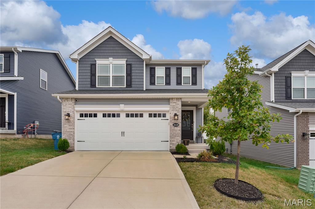 Looking for a home in the Pattonville School District? Discover this beautifully maintained 3+ bedroom, 3.5 bath home with a finished lower level and fully fenced yard—move in ready and only three years old, with thoughtful after market upgrades throughout. Built by Fischer & Frichtel, this two story home offers a layout that feels noticeably more open and spacious than many others in the neighborhood.  A charming covered front porch welcomes you inside to an airy open concept main floor featuring generous Living and Dining areas with direct access to the patio and backyard. The stylish Kitchen is designed to impress with 42” cabinetry, a double pantry, quartz countertops, and a tiled backsplash. All appliances stay—including the washer and dryer. A convenient powder room and access to the attached two car garage complete the main level, which is finished with durable, easy care LVP flooring.  Upstairs, the bright and spacious primary suite offers a walk in closet and private ensuite bath. Two additional bedrooms, a full hall bath with abundant counter space, and a cozy loft area round out the second floor.  The finished lower level expands your living space with a full bath, laundry room, and a large family room featuring an egress window—perfect for a legal fourth bedroom if desired.  Newer carpet on the upper level in the Family Room adds warmth and comfort.  Located in the Mackay Vista subdivision, right on the Bridgeton/Maryland Heights border within the Pattonville School District, this small private community sits next to Mathews Community Park, offering a playground, ball field, pavilion, and restrooms. With quick access to Dorsett Road, I 70, I 270, and Highway 67—and the added benefit of the Bridgeton Community Center—this neighborhood delivers both convenience and charm.  Open House  Sun 3/1 1-4