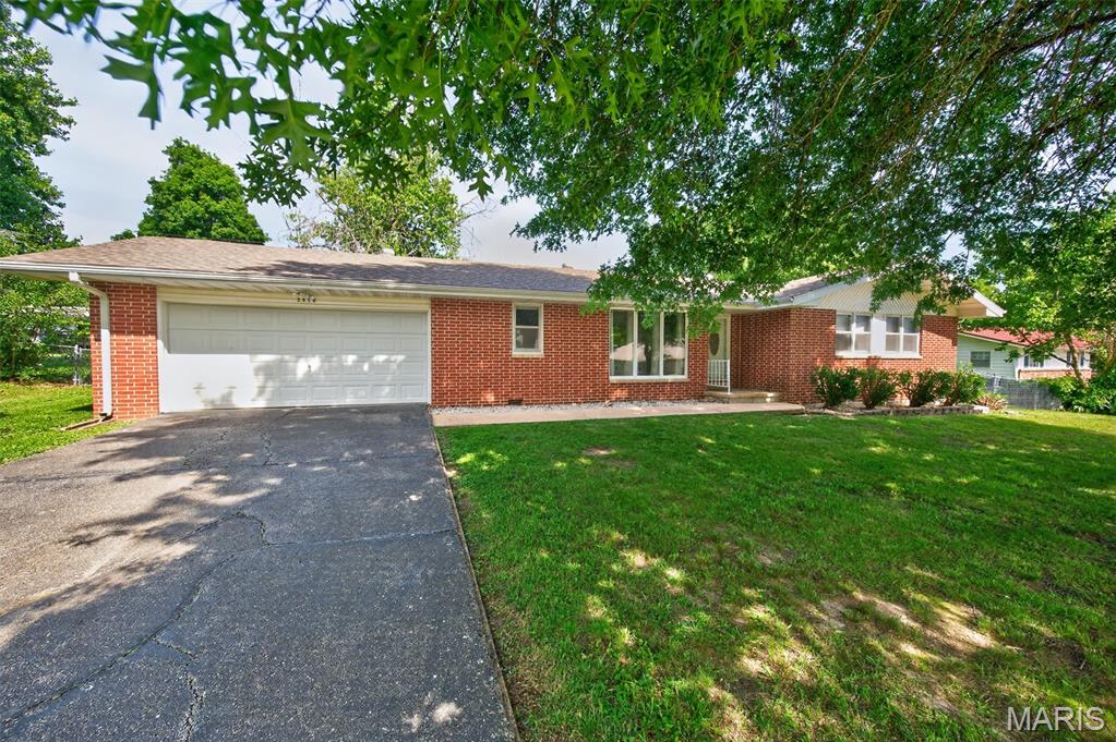NICE AND SPACIOUS HOME! Over 1600+ sq ft. of living space. This Brick house offers a harmonious blend of classic design and contemporary comfort. The layout is nice: 3 Bedrooms, 2 baths, and a spacious living room, family room, and dining room. The home has been well cared for and has some updates over time. like flooring, paint colors, lighting, appliances, and a newer roof back in 2021. You will love the backyard too, a brand-new back deck, a chain-link fence, and a nice backyard. The residence is near stores, parks, and complements, with a nice attached 2-car garage and practical storage, too! You will love this house located on the south side of town.