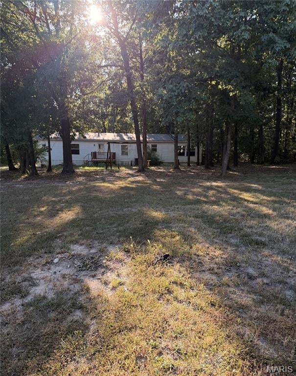 Large manufactured home on 3.21 +/- acres, featuring large windows for natural light throughout the home. Do you enjoy a nice fire on a cool fall evening? This home features a wood-burning fireplace! Sit in the living area and relax by the fire while enjoying your pumpkin spice beverage. Plenty of space outside with mature trees for whatever you desire!
This home needs some sweat equity, but you can live in it and update it as you go! Sorry, no FHA or USDA financing.