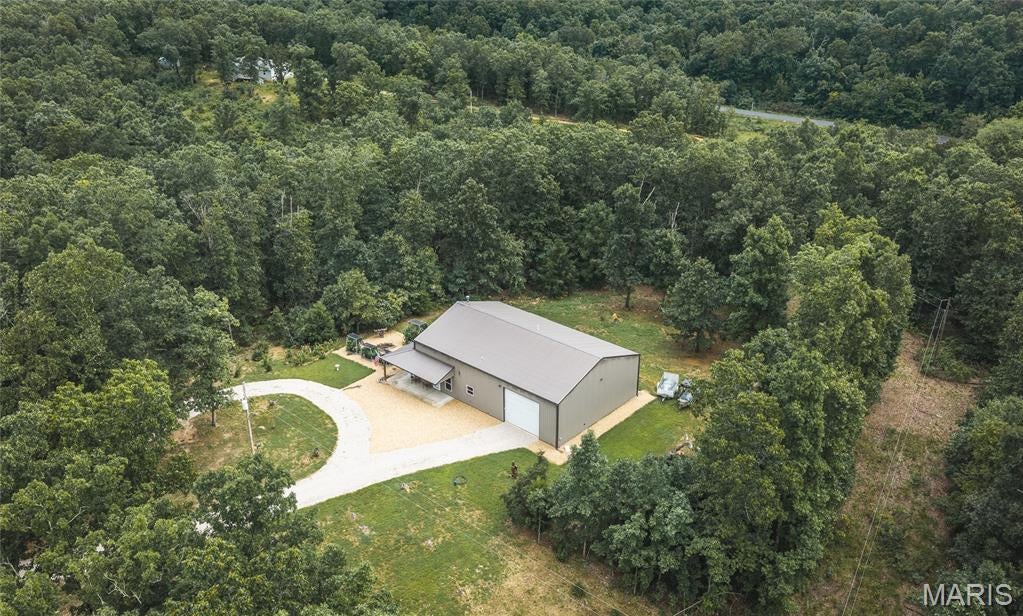 This 10.07+- acre Dent County property on County Road 4285 near Salem, Missouri pairs a 2017 barndominium with an attached 1,120 square foot garage and enough ground for hunting, gardening, and room to roam in the Missouri Ozarks.

Built in 2017, the barndominium offers approximately 1,280 square feet of finished living space with two bedrooms and two full bathrooms. The home sits on a concrete foundation and features a metal exterior, gable-style metal roof, drywall interior, finished concrete floors, and forced-air heat with central air. The attached 28 x 40 garage holds your vehicles, tools, ATVs, lawn equipment, and hunting gear with workspace left over for projects and property maintenance.

Outside, the 10.07+- acres give you room for recreation and hunting while remaining a manageable size to care for. Deer and turkey are present in the area, putting hunting opportunities close to home. A 336 square foot covered porch, a landscaped yard, and a maintained raised-bed summer garden round out the homesite.

The surrounding country holds some of the best-known public outdoor resources in the Missouri Ozarks. Montauk State Park sits southwest of Salem at the headwaters of the Current River and offers trout fishing, camping, hiking, and river access. The 13,503-acre Indian Trail Conservation Area lies in northeast Dent County, and the Meramec River system and the Mark Twain National Forest add thousands more acres of public ground for hunting, fishing, hiking, and wildlife viewing.

The property lies in the Salem R-80 School District. Salem is the primary nearby community for shopping, supplies, restaurants, and services, with Rolla, St. James, Steelville, and Licking within the broader region.

This property is well suited as a primary residence, recreational property, or hunting base. Contact me today to schedule a showing.