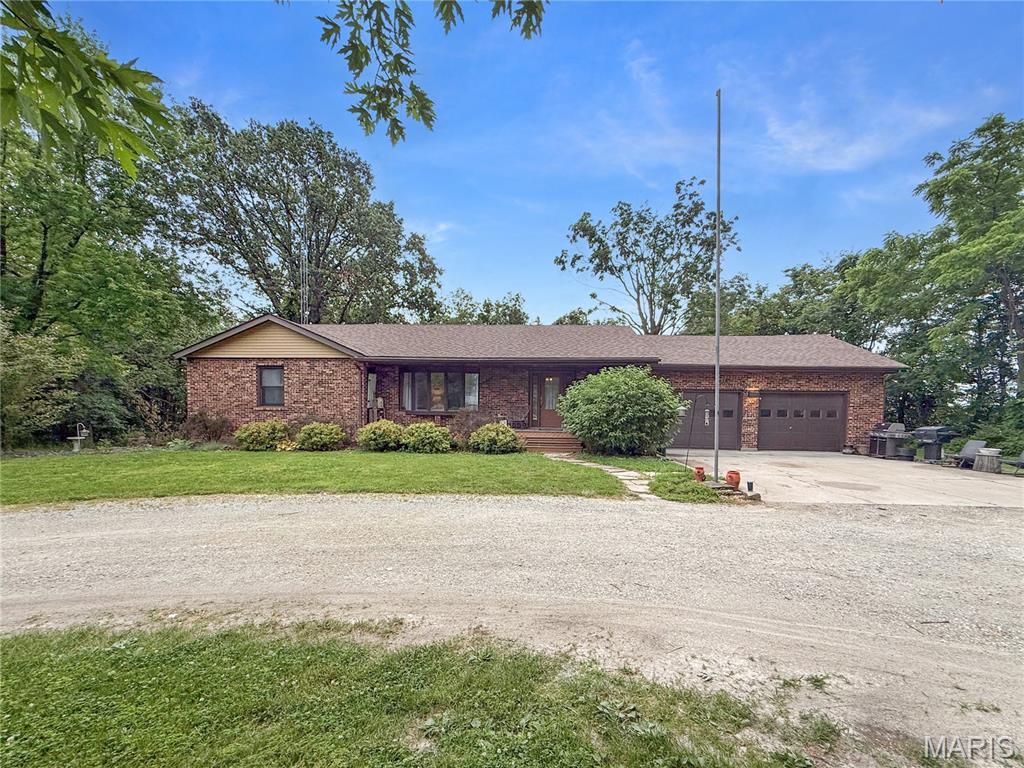 Welcome to country living just outside Bowling Green! Situated on approximately 6 acres, this spacious all-brick home offers over 3,600 square feet of living space with 3 bedrooms, 3 full bathrooms, and plenty of room to enjoy both indoors and out. Surrounded by mature trees and open green space, this property provides the perfect setting for those looking for space, comfort, and versatility.
Inside, you'll find generous living areas, a large kitchen with abundant cabinetry, and a spacious primary suite featuring deck access and beautiful views of the backyard. The walk-out basement expands your living space and includes a custom bar area, making it ideal for entertaining, hobbies, or a recreation room.
Outside, enjoy the large deck (which will have a fresh coat of stain soon!) overlooking the acreage, an expansive yard, and a detached shop that offers endless possibilities for storage, projects, or equipment. Whether you're looking for room for outdoor activities, a workshop, or simply a little extra elbow room, this property has it all.
