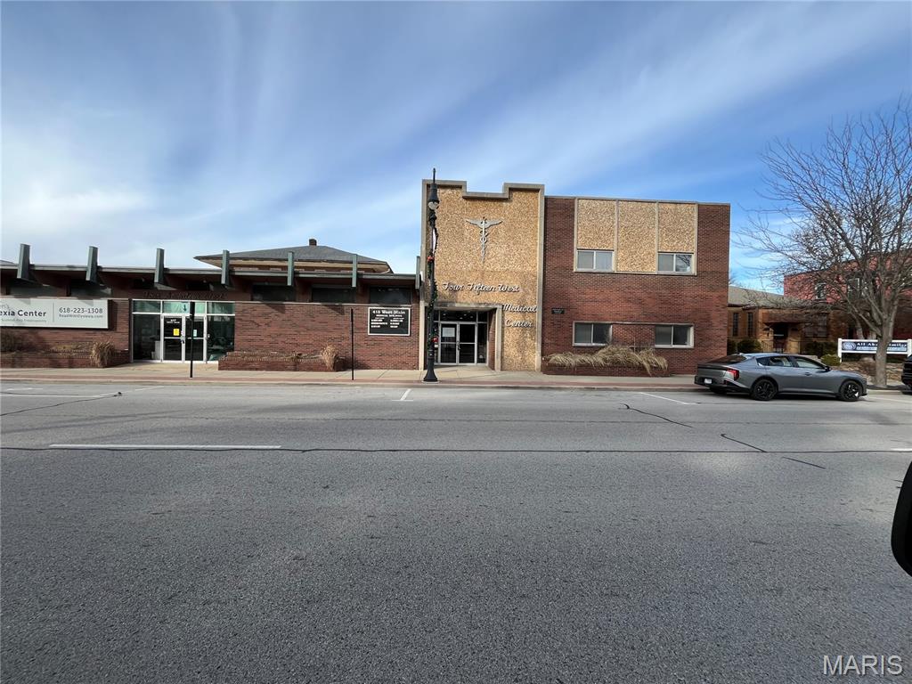 Prime second-floor medical office space available in the heart of downtown Collinsville. Ideally positioned on the corner of a highly trafficked main corridor, this professional suite offers excellent visibility and convenient access for both patients and staff. The building features elevator service, ensuring full ADA accessibility. The space has been recently updated with fresh paint and new carpeting, creating a clean, modern environment ready for immediate occupancy. Designed for medical or healthcare users, each exam room is equipped with its own sink, supporting efficient clinical workflow and sanitation standards. Located within a vibrant downtown setting surrounded by retail, dining, and community amenities, this property offers an ideal opportunity for medical, wellness, or professional office users seeking a central and accessible location.