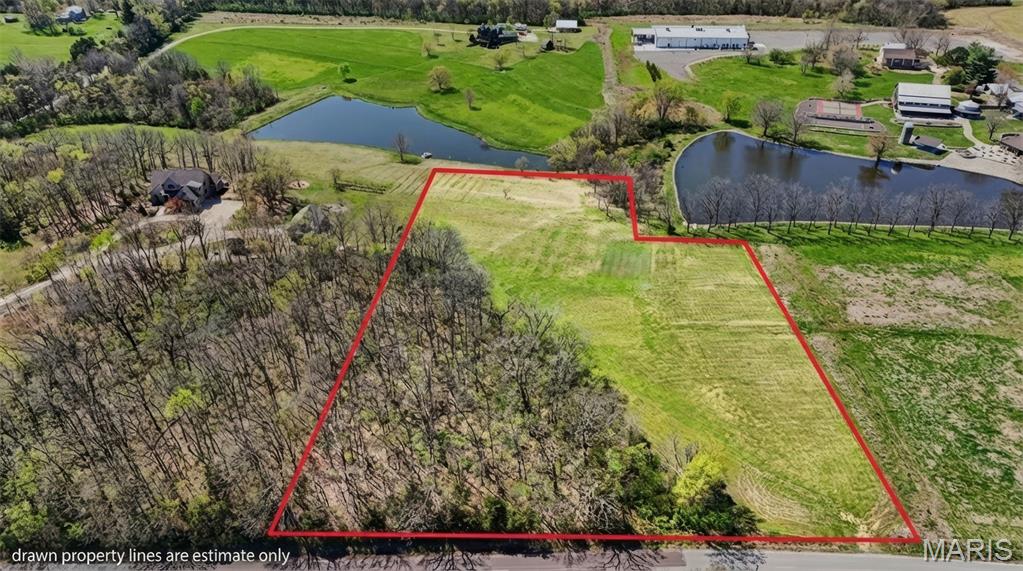 Discover the perfect blend of privacy and possibility on this 4.456 acre unrestricted lot just west of Washington! Situated in a serene, park-like setting, this rare gem offers the freedom you’ve been searching for! With no homeowner's association and no restrictive covenants, you're looking at just pure potential!! The land features a beautiful mix of pasture and woods, with a gentle slope that is ideal for a walk-out basement. Here, you'll enjoy tranquil lake views and the peace of the countryside while remaining within the sought-after Campbellton Elementary District. Whether you're planning a custom estate, a hobby farm, or a weekend retreat, this is a rare opportunity! Secure your future home site TODAY!