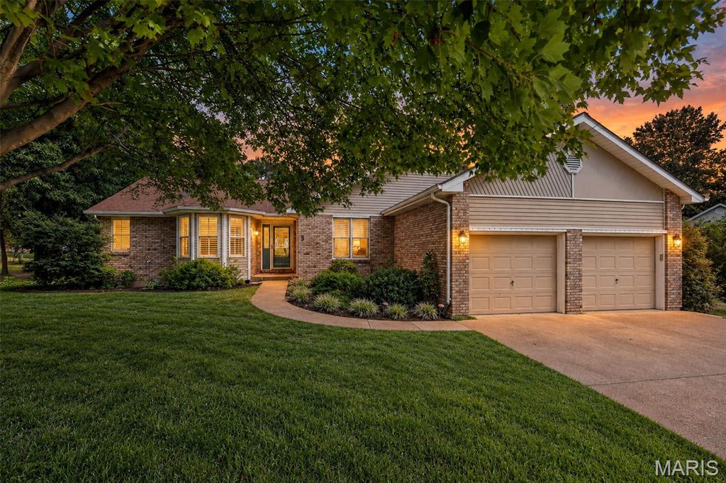 Welcome home to this beautiful 5-bedroom 3-bathroom ranch nestled in an established neighborhood in Washington. Backing to a peaceful, stocked lake with your own little private dock this property offers the perfect blend of natural beauty privacy and convenience. Step inside to an open concept floor plan featuring brand new luxury vinyl plank flooring, new carpet throughout, some new lighting and fresh paint. The spacious main living area flows effortlessly with designated rooms still giving an open concept. This is an ideal setting for both everyday living and entertaining. Main floor has 3- bedrooms and a bonus room off the primary. This room has a big, beautiful window and could be used as an office, oversized closest, nursery, office or sitting room. The finished basement provides additional living spaces. With 2-bedrooms, a full bathroom, bonus room and a large extra room with access to a walkout the options for this space is endless. Enjoy morning coffee or evening sunsets from the deck overlooking mature trees, lush landscaping, and tranquil water views. With a 2-car garage, abundant living space, and locations just minutes from Washington's charming riverfront. Shopping, restaurants, and local amenities offers the small-town lifestyle you've been looking for with all the room you need to spread out. This listing has digitally enhanced photos to show the true potential this home has for its next owners.