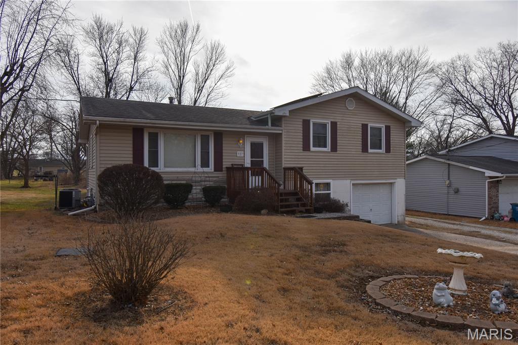PRICE IMPROVEMENT:  $225,000.  
Welcome to this well-maintained tri-level home located in the heart of Bethalto, Illinois. This inviting property offers 3 bedrooms and 1.5 baths, providing comfortable living space for everyday life and entertaining.  This home features a large eat-in kitchen with plenty of room for family meals, along with hardwood floors in the living room and all three bedrooms, adding warmth and character throughout. Step outside to enjoy the spacious deck, perfect for relaxing or hosting gatherings.  The home is equipped with solar panels that help reduce energy costs, offering long-term efficiency and sustainability. Solar panel lease to be paid off at closing by seller, making this an added value for the next homeowner.  Parking and storage are abundant with an attached 1-car garage plus a detached oversized 2-car garage, ideal for vehicles, hobbies, or a workshop. Peace of mind comes with upgraded sewer and basement waterproofing, providing added value and long-term reliability.  Situated in a great location, this home is conveniently close to schools, shopping, and dining, making daily errands and commutes a breeze. Don't miss this wonderful opportunity to own a versatile and functional home in a desirable neighborhood.