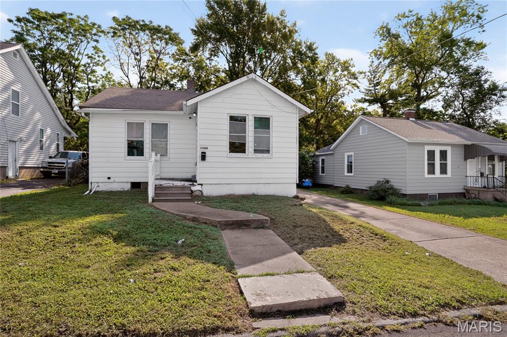 Welcome home to 2344 Burns Ave, a classic single-story brick residence offering low-maintenance living in St. Louis! Featuring 2 bedrooms, 1.5 bathrooms (1 full bath, 1 half bath), and 974 square feet of functional interior living space on a generous 0.22-acre lot (9,649 sq ft), this home delivers an efficient floor plan designed for easy everyday living.  Inside, light-filled common areas include a cozy main living room flowing smoothly into a practical central kitchen and dedicated dining space. Both bedrooms provide versatile accommodations, complemented by a main full bath and additional half bath for daily convenience. The property also features a full basement offering ample extra storage space.  Outside, enjoy off-street parking and a spacious backyard setting—ideal for outdoor relaxation, pets, or gardening. Conveniently located in St. Louis County near local schools, neighborhood parks, shopping, and major commuting routes