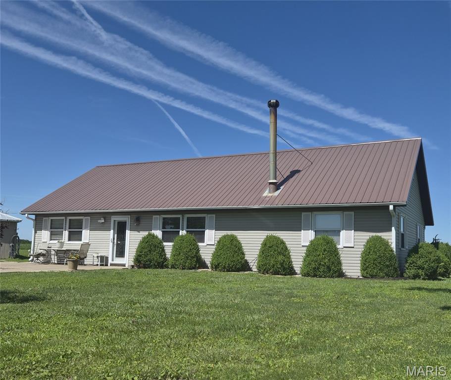 Built in 2012, this 4 bedroom/2 bath 2200+ sqft Adams county home sits on about 1.6 acres. Open concept layout  finished in true country form with pine stairs, 6 panel oak doors & trim plus rich hickory cabinets in the kitchen. Huge loft upstairs, private covered patio and garage/shop. Wood stove keeps utility bills low in the winter. Oversize garage/shop boasts overhead door and electric to help you finish all your projects. Large carport, woodshed and select furniture items convey. Enjoy the Country Life so close to Quincy today.