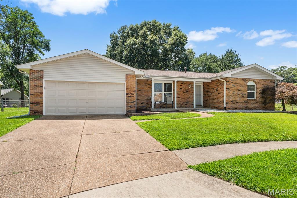 Welcome home to this beautifully updated ranch nestled on a quiet cul-de-sac in the heart of Oakville! Offering 3 bedrooms, 2 full baths, and an open, inviting floor plan, this move-in ready home is sure to impress. The updated kitchen features 42-inch cabinetry, gorgeous Cambria quartz countertops, a gas range, and all appliances stay—including the refrigerator, washer, and dryer! Gleaming wood-look laminate flooring flows throughout most of the main level, complemented by new carpet in two bedrooms and six-panel doors throughout. The spacious family room is highlighted by a stunning floor-to-ceiling gas fireplace, creating the perfect gathering space. Major updates provide peace of mind with a new roof (2023), air conditioner (2022), and furnace (2021). The unfinished lower level offers endless possibilities with a rough-in bath already in place, ready for your future finish. Step outside to enjoy the large, level, fenced backyard with stamped concrete patio; ideal for entertaining, pets, or play. Located in a highly sought-after neighborhood featuring a community pool, tennis courts, sand volleyball, basketball court, playground, and convenient access to schools, shopping, restaurants, and major highways, this home truly has it all!