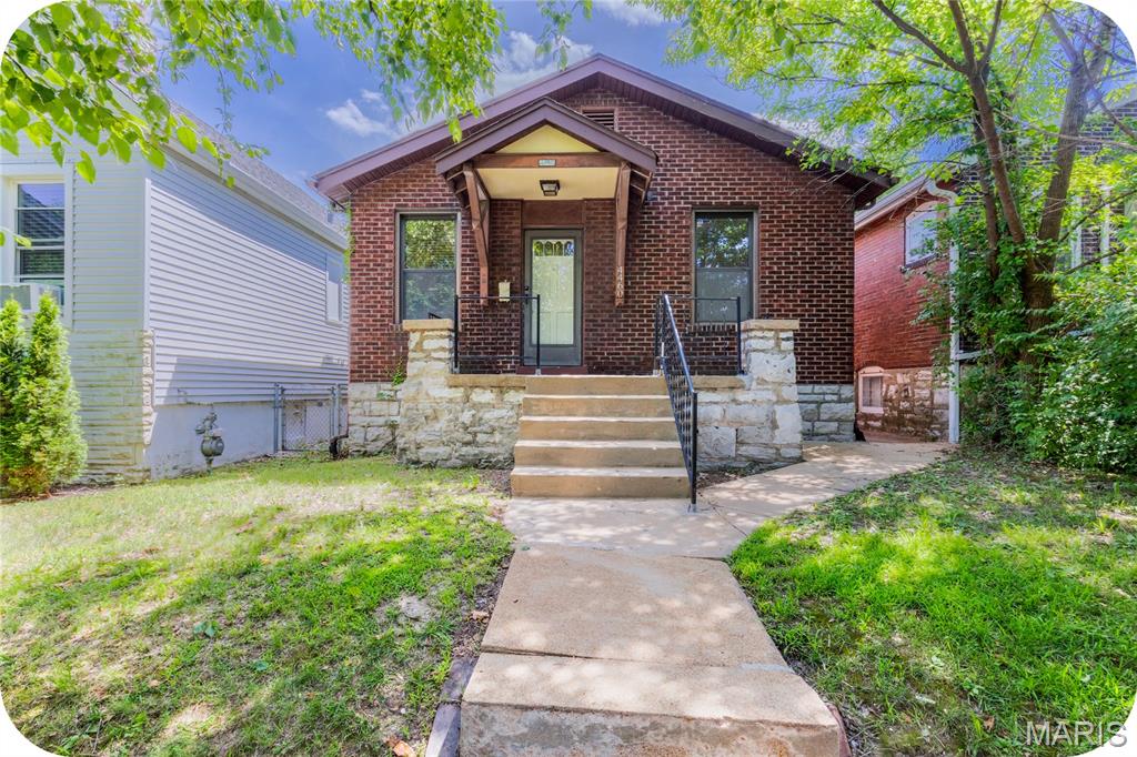 This brick Bevo charmer proves that great things come in just the right size. Inside, you'll find an open living and dining area anchored by original hardwood floors and a layout that feels comfortable from the moment you walk in. Two cozy bedrooms and a spacious kitchen offer all the essentials without wasted space. Out back, enjoy a fenced yard, detached garage, and bonus storage/workshop area. The clean basement provides plenty of room for storage, hobbies, or future finishing potential. Just moments from neighborhood favorites like Tim's Chrome Bar and the iconic Bevo Windmill, this is an affordable home that delivers exactly what you're looking for.